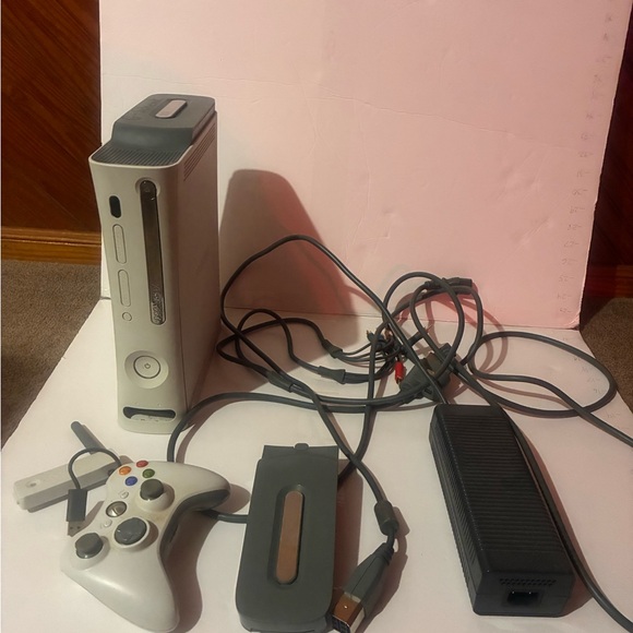 Xbox 360 with 32 discs games and three additional controllers